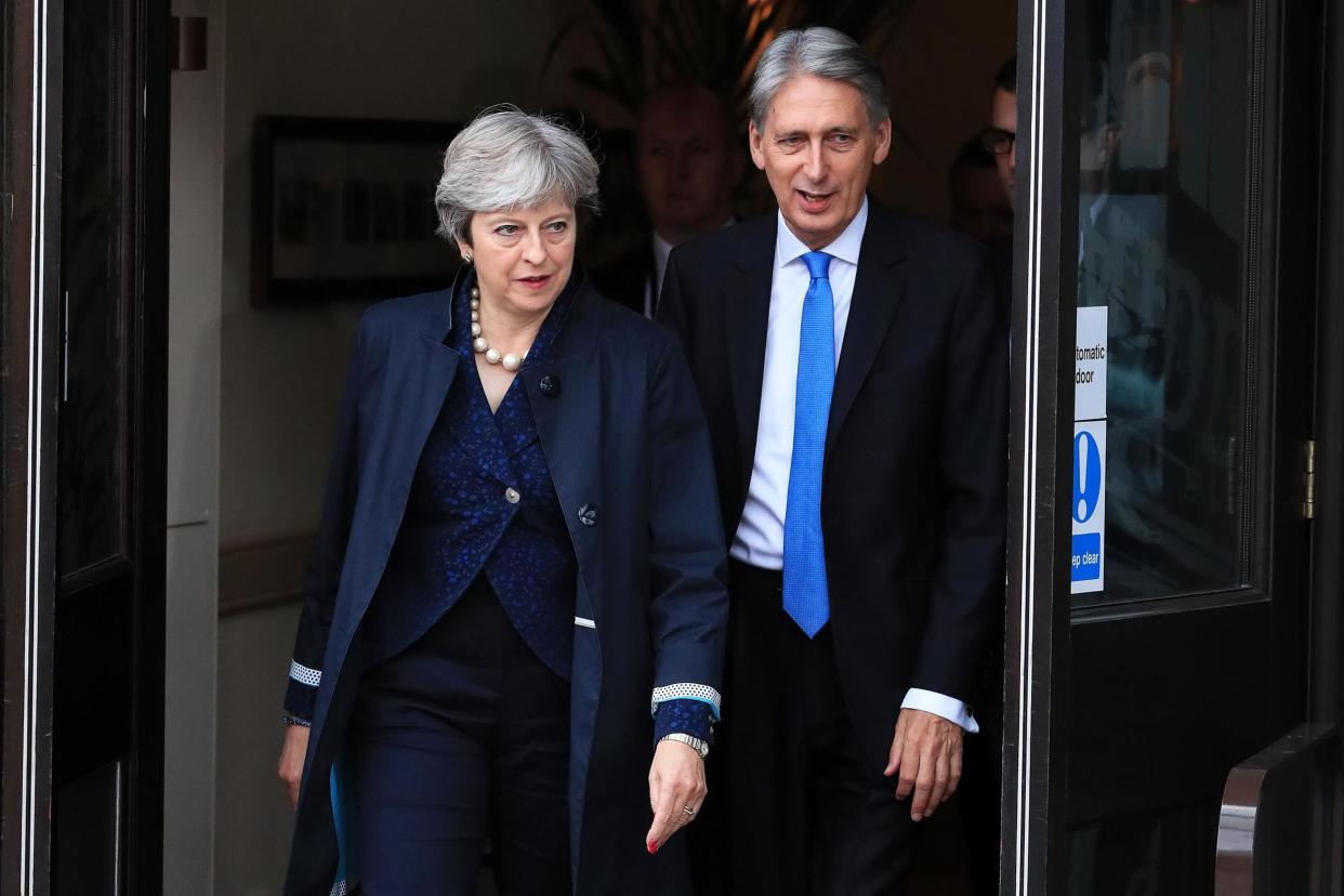 Prime Minister Theresa May and Chancellor Philip Hammond: PA