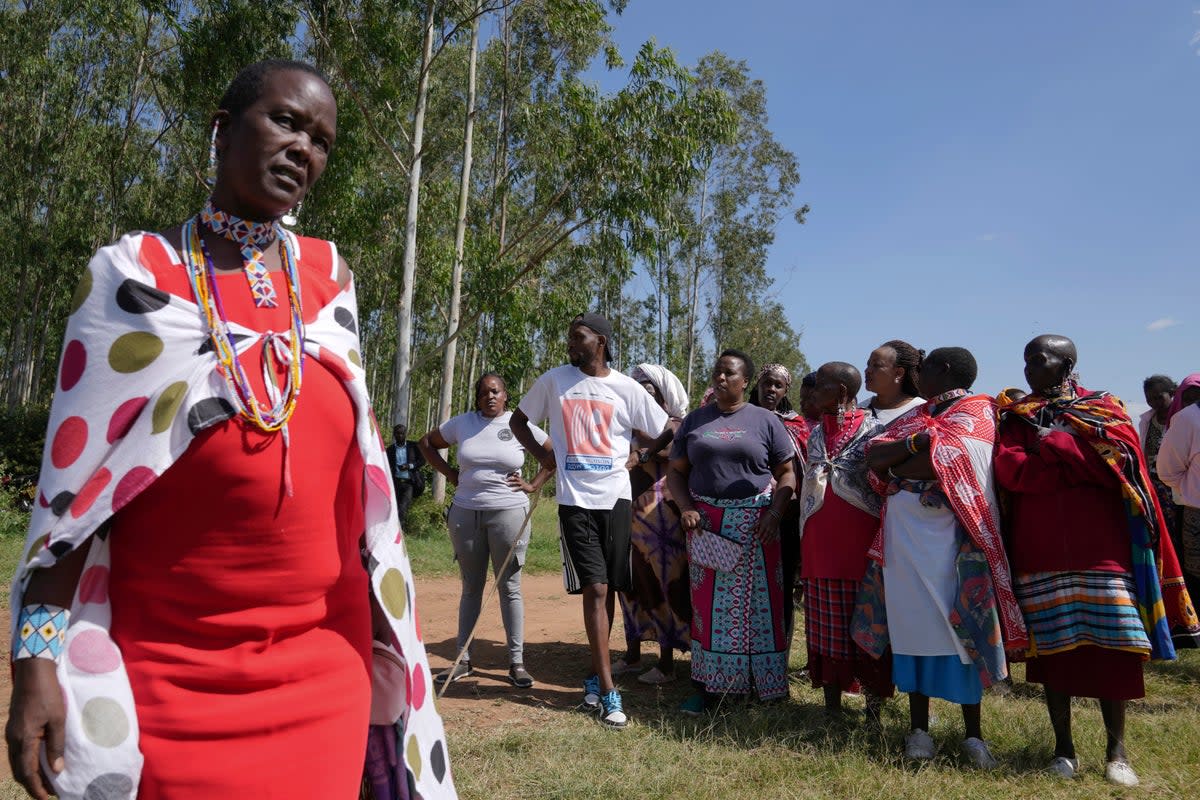 Family and friends gather to mourn Anthony Shungea Pasha who was killed by hyenas while he was collecting firewood at a forest neighbouring his homestead, in Kajiado, Kenya Tuesday (AP)