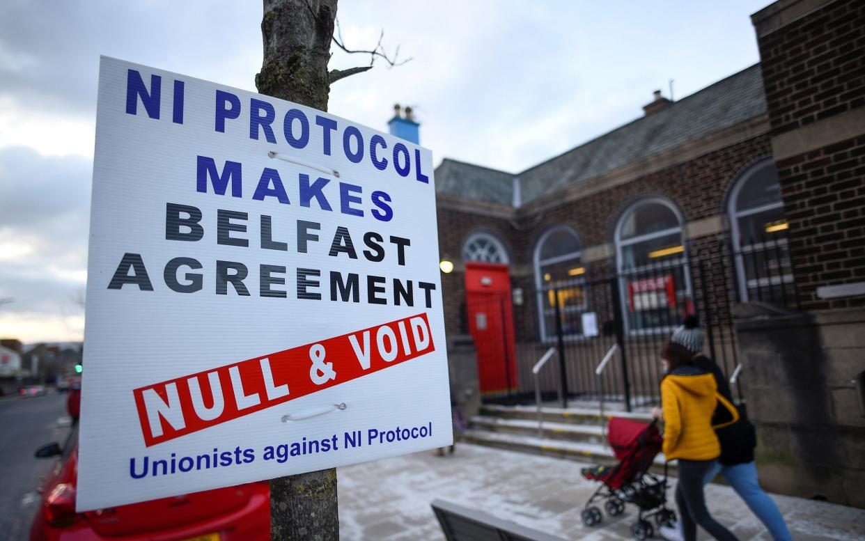 A sign is seen with a message against the Brexit border checks in relation to the Northern Ireland protocol in Larne -  CLODAGH KILCOYNE/ REUTERS