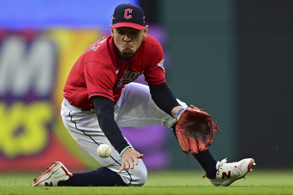 Cleveland Guardians second baseman Andres Gimenez fields a ball hit by St. Louis Cardinals' Nolan Arenado during the fourth inning of a baseball game, Saturday, May 27, 2023, in Cleveland. (AP Photo/David Dermer)