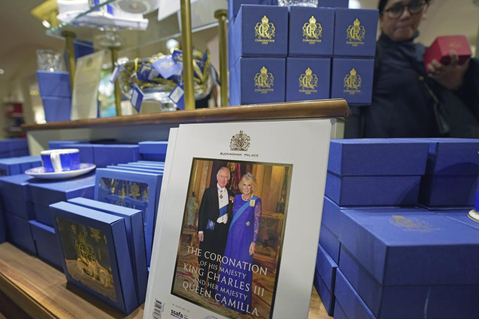 Souvenirs are displayed for sale in a gift shop ahead of King Charles III's Coronation in London, Monday, April 24, 2023. The May 6 coronation is luring royal fans and far-flung visitors fascinated by the ceremonial spectacle — and drama — of the monarchy and eager to experience a piece of British history. Tour companies, shops and restaurants are rolling out the red carpet, whether it's a decked-out bus tour of London's top sights boasting high tea or merchandise running from regal to kitschy. (AP Photo/Kin Cheung)