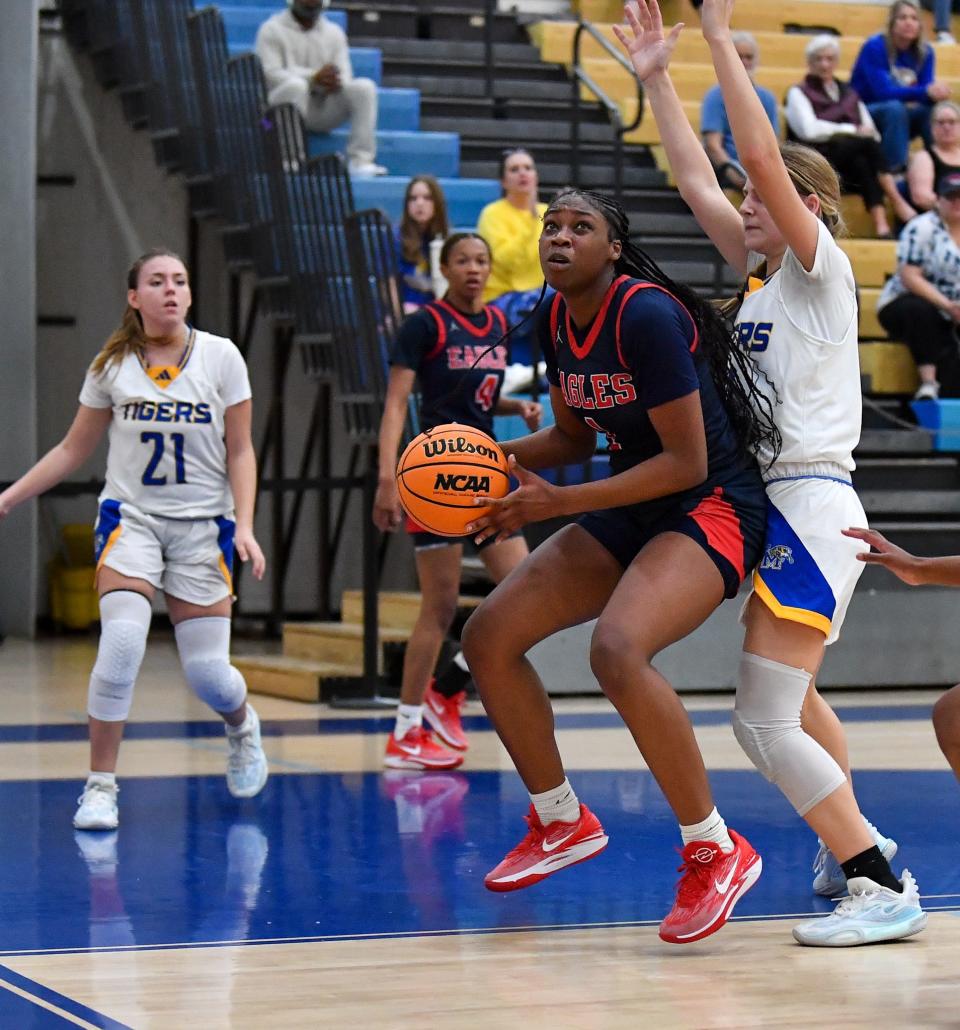 Centennial's Jailyn Williams (1) attempts a shot in a girls high school basketball game, Tuesday, Jan. 23, 2024.