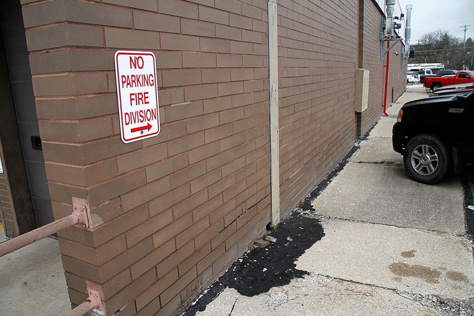 Patch work on the rear northwest side of the Ashland Fire Station No. 1 is seen here on Friday, Jan. 14, 2022. When there is a good rain the water enters the building through holes in the bricks since the sidewalk along side the building over time has begun to slope toward the building.