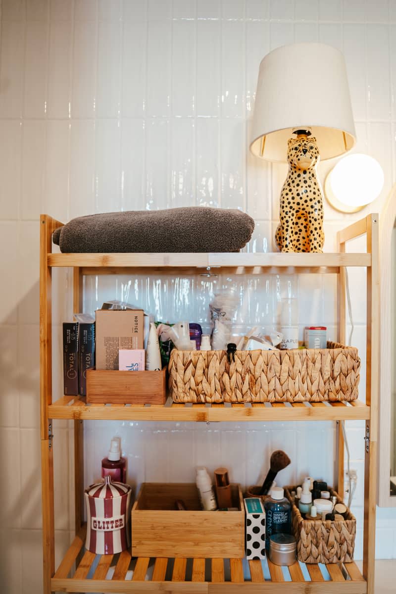 Leopard lamp on bathroom shelf.