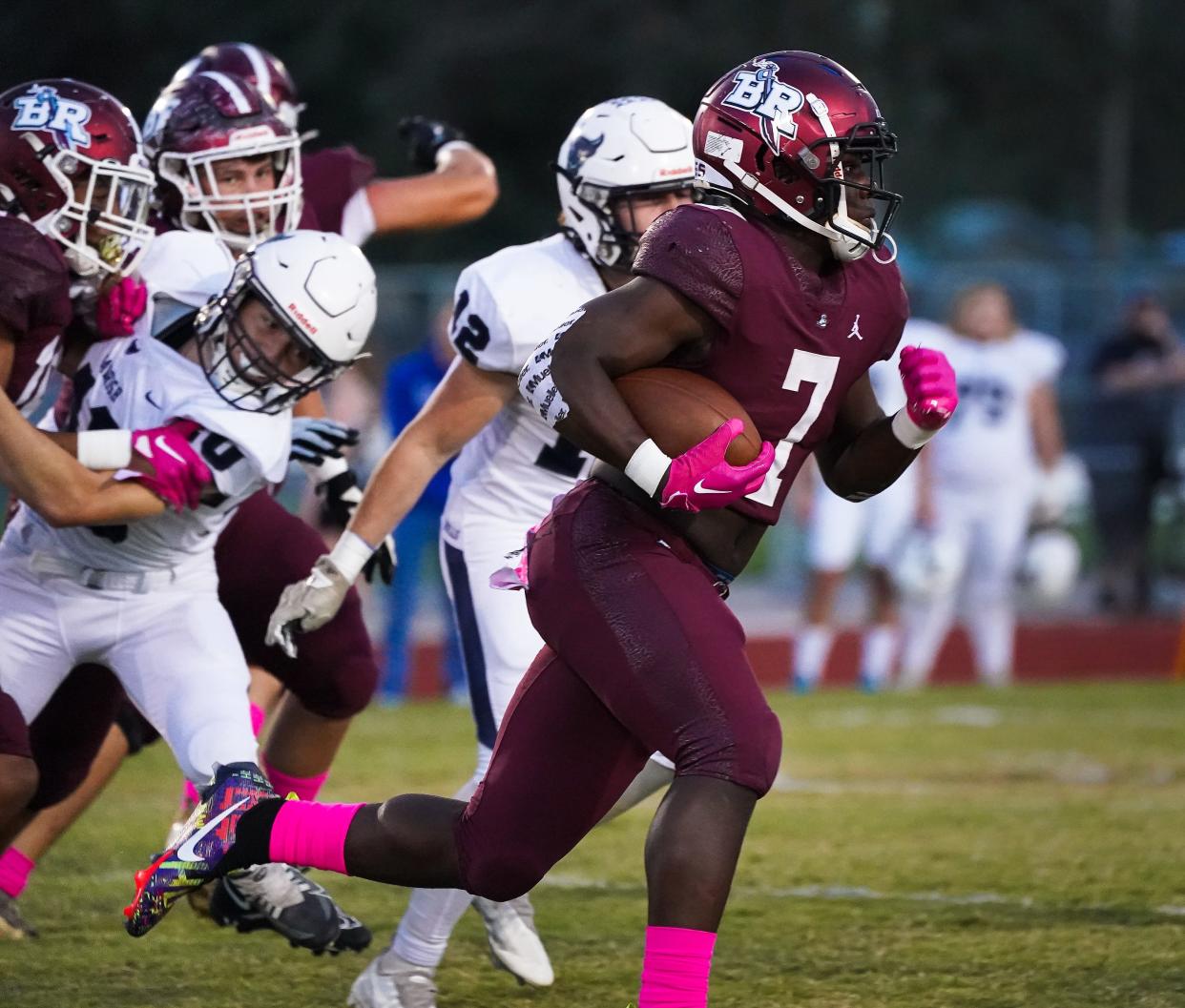 Braden River's Trayvon Pinder runs for yardage against Parrish Community. Pinder had three touchdowns in the fourth quarter to lead the Pirates to a come-from-behind win over the Bulls.