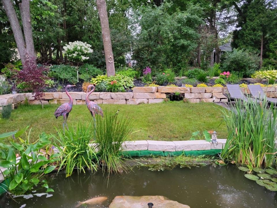 A perennial garden accented with tropical plants, a koi pond and four land tortoises is on the Menomonee Falls Community League Tour June 25.