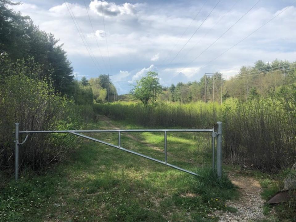 The Reids were found in a wooded area off Marsh Loop Trail, less than two miles from their Concord home; an entrance to the trail is pictured weeks after their deaths (Sheila Flynn)