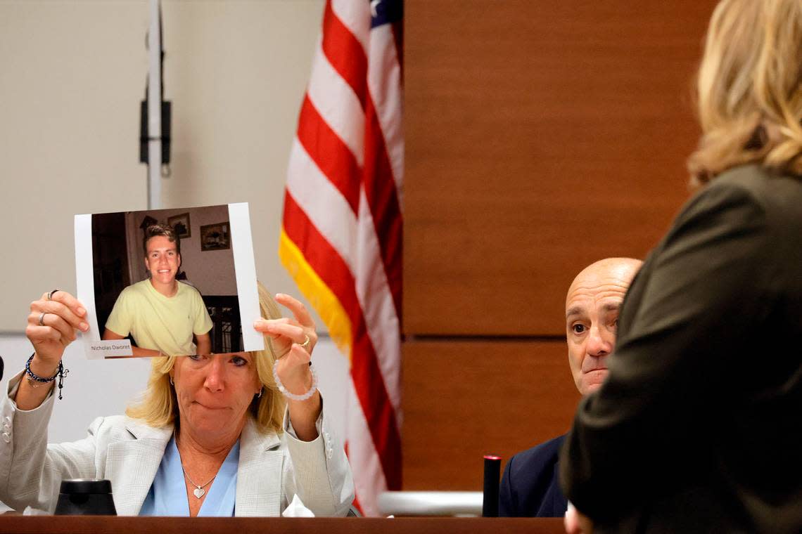 Annika Dworet holds a photo of her son, Nicholas, as she and her husband, Mitch, take the stand to give their witness impact statements during the penalty phase of the trial of Marjory Stoneman Douglas High School shooter Nikolas Cruz at the Broward County Courthouse in Fort Lauderdale on Tuesday, Aug. 2, 2022. Nicholas was killed, and the Dworet’s other son, Alexander, was injured in the 2018 shootings.