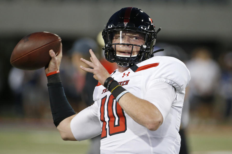 Texas Tech quarterback Alan Bowman (10) warms up prior to an NCAA college football game against Arizona, Saturday, Sept. 14, 2019, in Tucson, Ariz. Texas quarterback Sam Ehlinger lost his top receiving targets from a year ago but has found plenty of options so far in 2020. The No. 8 Longhorns spread around seven touchdowns to seven different receivers in their first game. Now they go on the road to open Big 12 play against Texas Tech. Bowman was one of the top freshman quarterbacks in the country in 2018 only to have part of that season and much of 2019 wiped out by injuries. He's back and threw for 430 yards against Houston Baptist. (AP Photo/Ralph Freso)