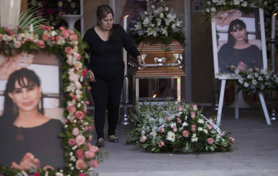 Pictures of Rosa Alma Barragán surround her casket