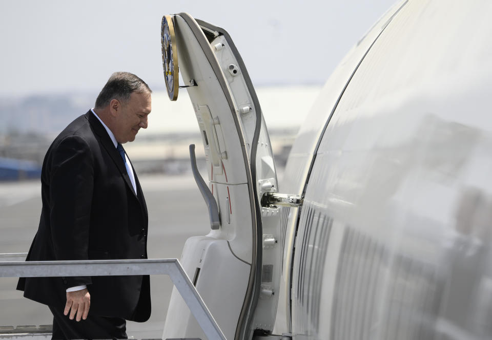 US Secretary of State Mike Pompeo enters the plane before departing from the Addis Ababa Bole international Airport in Addis Ababa, Ethiopia, on Wednesday Feb. 19, 2020. (Andrew Caballero-Reynolds/Pool via AP)