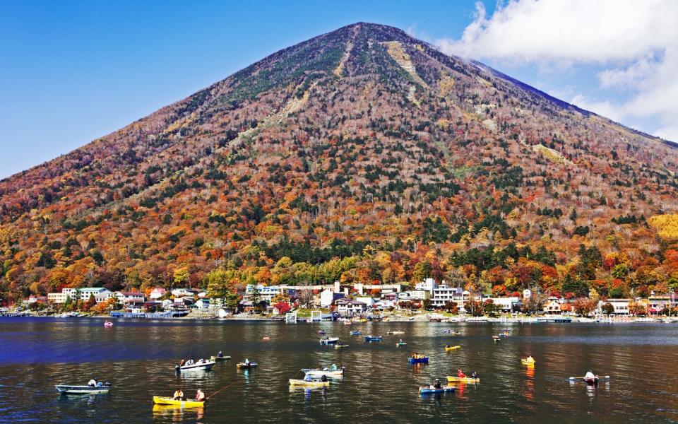 People fishing off Mount Nantai