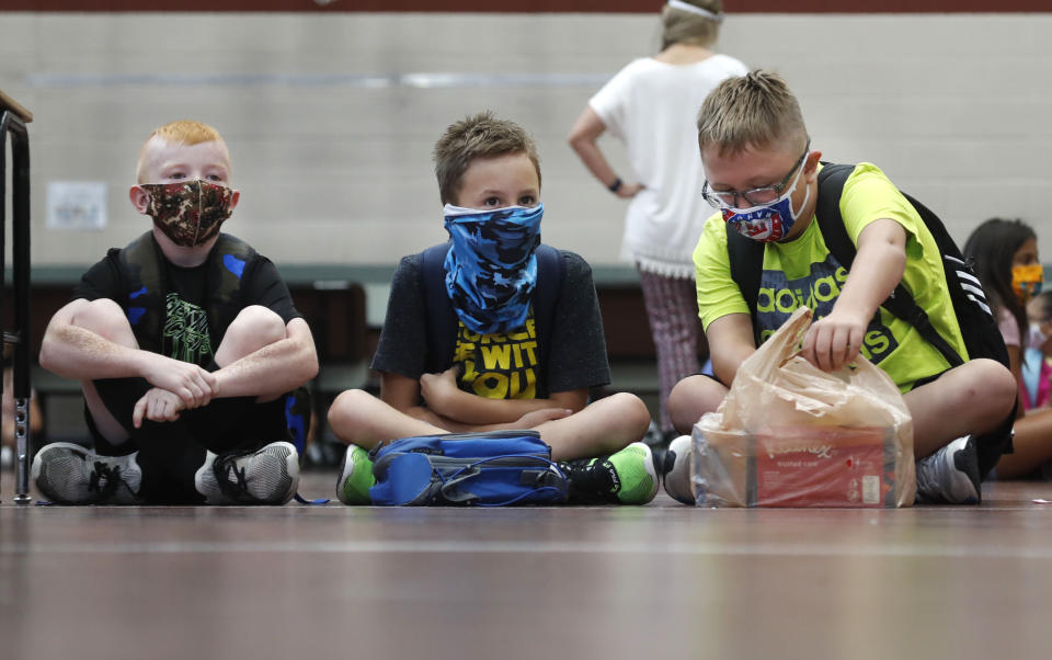 Elementary school students wait for classes to begin in Godley, Texas, on Wednesday. States in the South and Southwest have recently seen the highest number of new coronavirus cases per capita. (Photo: ASSOCIATED PRESS)