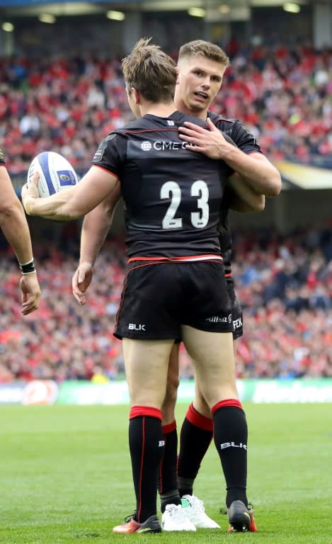 Saracens' Chris Wyles (L) celebrates with Owen Farrell after scoring a try during their rugby union European Champions Cup semi-final match against Munster, at the Aviva stadium in Dublin, on April 22, 2017