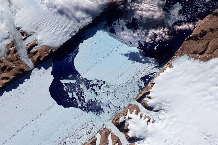 This NASA Earth Observatory image obtained on July 27, 2012, shows a massive ice island as it broke free of the Petermann Glacier in northwestern Greenland