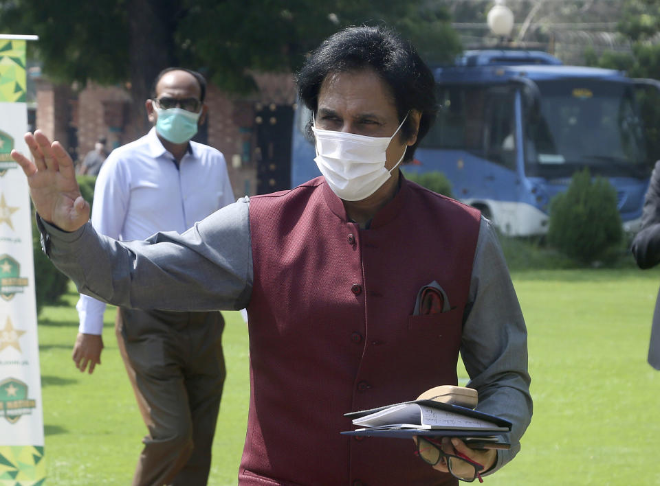 Ramiz Raja, former Pakistan cricketer and candidate for the chairman of Pakistan Cricket Board, waves to media as he arrives to attend PCB's governing board meeting, in Lahore, Pakistan, Monday, Sept. 13, 2021. Raja is set to become the new chairman of the country's cricket board. Prime Minister Imran Khan, in his role as patron of the Pakistan Cricket Board, nominated Raja to the governing board after Ehsan Mani declined to accept a short-term extension when his three-year term expired last week. (AP Photo/K.M. Chaudary)