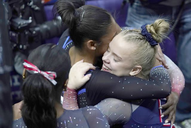 <p>Pier Marco Tacca/Getty </p> Joscelyn Roberson (right) and Simone Biles