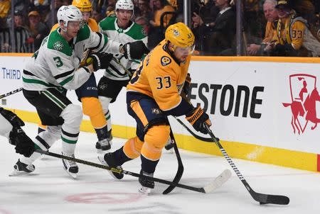 Feb 7, 2019; Nashville, TN, USA; Nashville Predators right wing Viktor Arvidsson (33) controls the puck against Dallas Stars defenseman John Klingberg (3) during the third period at Bridgestone Arena. Mandatory Credit: Christopher Hanewinckel-USA TODAY Sports