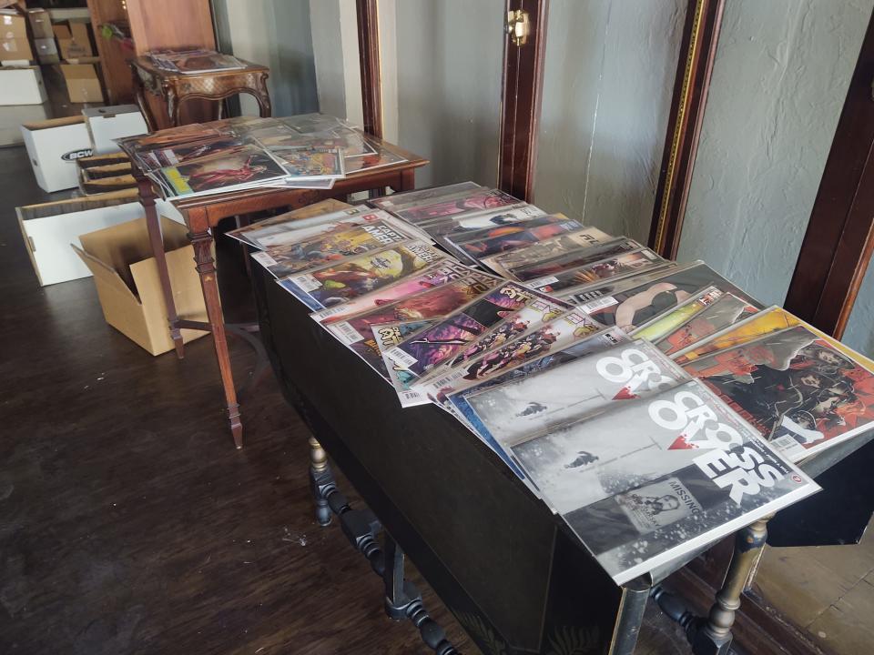 A display of comics sits out during a fire sale at Wolverine Comics in Sherman Thursday. The comic shop is raising money to relocate following a fire at Kelly Square in October.