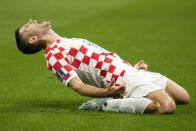 Croatia's Andrej Kramaric celebrates after scoring his side's opening goal during the World Cup group F soccer match between Croatia and Canada, at the Khalifa International Stadium in Doha, Qatar, Sunday, Nov. 27, 2022. (AP Photo/Aijaz Rahi)