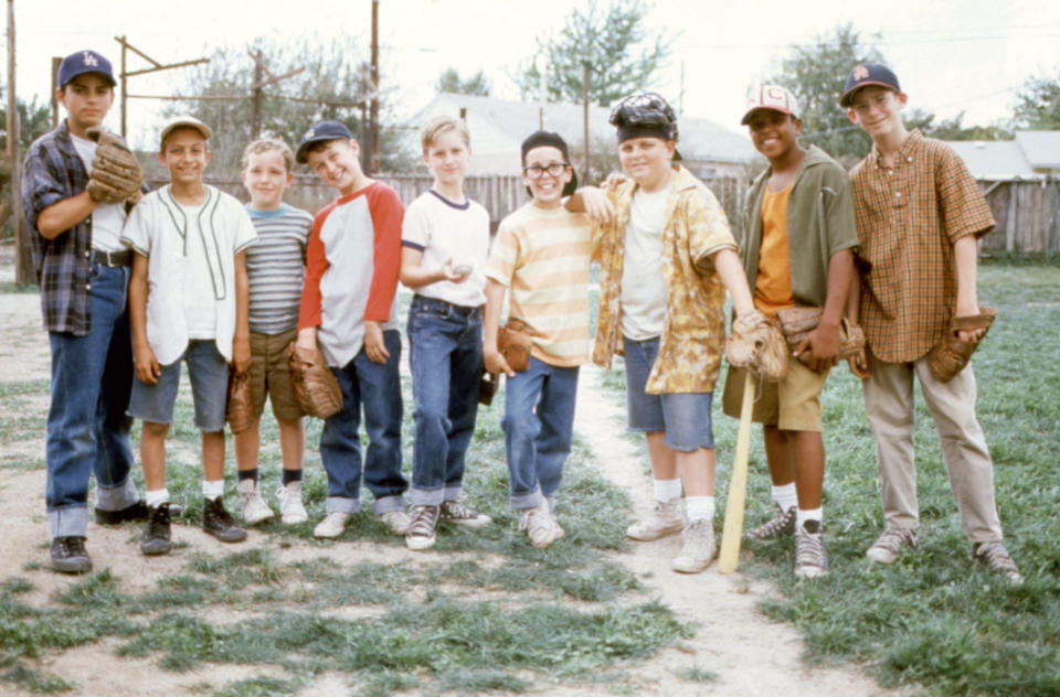 Mike Vitar, Marty York, Shane Obedzinski, Victor DiMattia, Tom Guiry, Chauncey Leopardi, Patrick Renna, Brandon Adams, and Grant Gelt stand on a baseball field