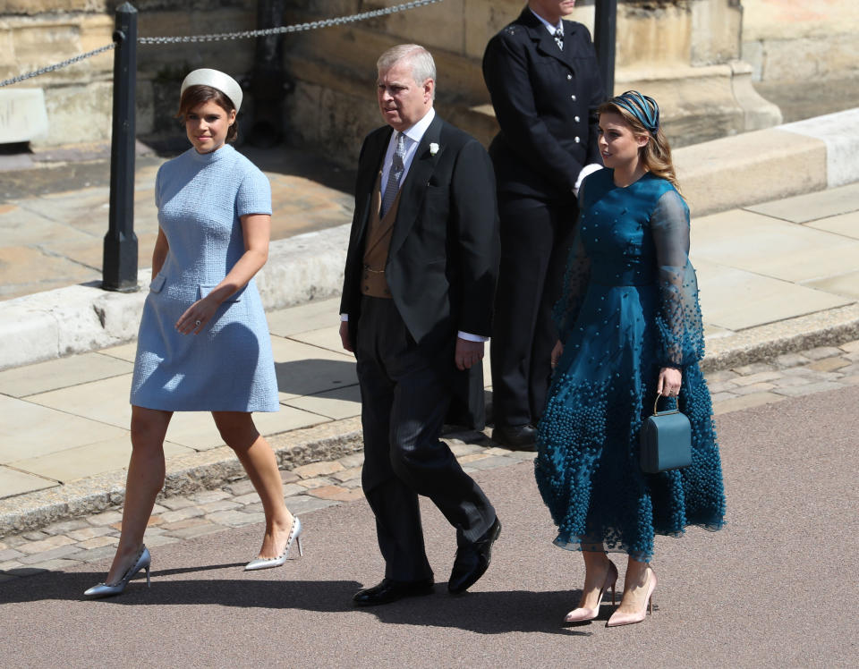 <p>Harry’s cousins Eugenie and Beatrice showed off two very different looks, with Eugenie in a pale shift dress and her older sister in a teal gown. Photo: Getty </p>