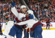 Colorado Avalanche left wing J.T. Compher (37) celebrates his goal against the Edmonton Oilers with Bowen Byram (4) during the third period of Game 3 of the NHL hockey Stanley Cup playoffs Western Conference finals, Saturday, June 4, 2022, in Edmonton, Alberta. (Jason Franson/The Canadian Press via AP)