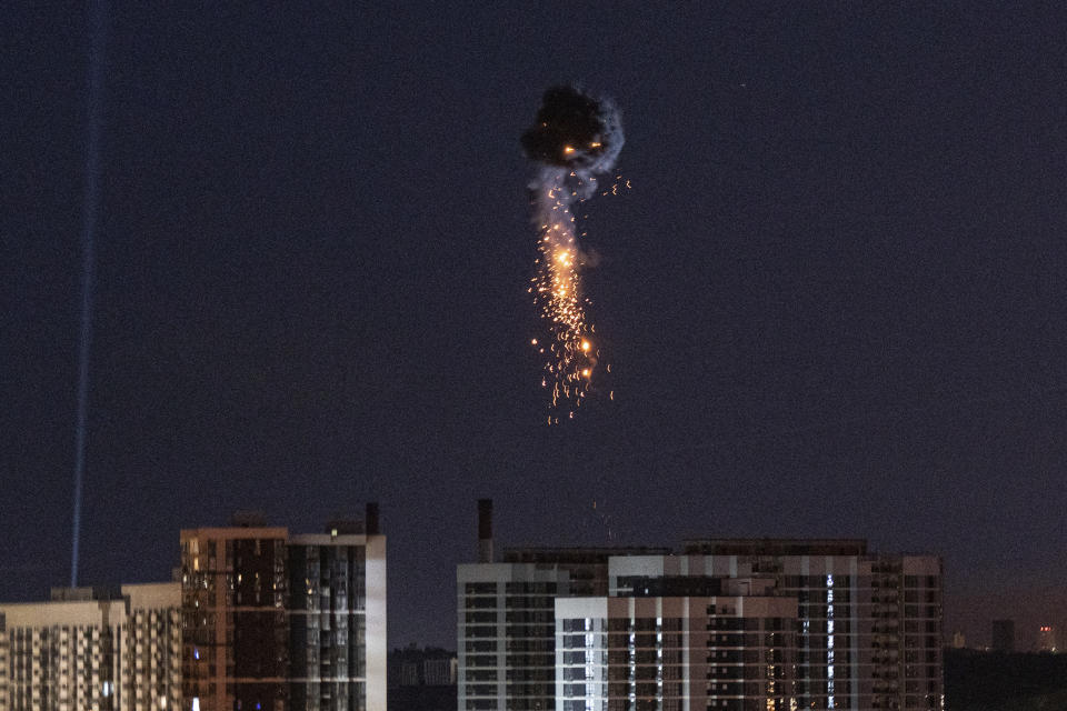 Ukrainian air defense intercepts a Shahed drone mid-air in the third Russia aerial attack on the capital in the last 24 hours in Kyiv, Ukraine, Tuesday, May 30, 2023. (AP Photo/Evgeniy Maloletka)