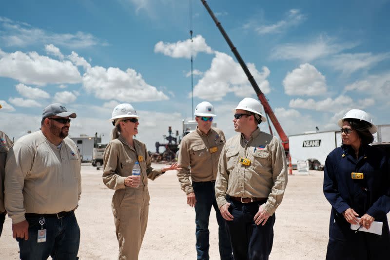 FILE PHOTO: Chevron personnel work at an oil exploration drilling site near Midland