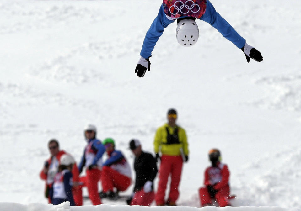 Anton Kushnir of Belarus jumps during freestyle skiing aerials training at the Rosa Khutor Extreme Park at the 2014 Winter Olympics, Monday, Feb. 10, 2014, in Krasnaya Polyana, Russia. (AP Photo/Andy Wong)