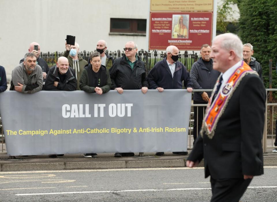 A Call It Out banner in Easterhouse (Robert Perry/PA) (PA Wire)