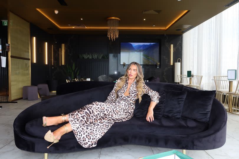 Samantha Kenny from Love Island 2024 modelling the KALLI LEOPARD SATIN BLOUSE AND MIDI SKIRT CO-ORD for Glamify / Glamifyfashion.com