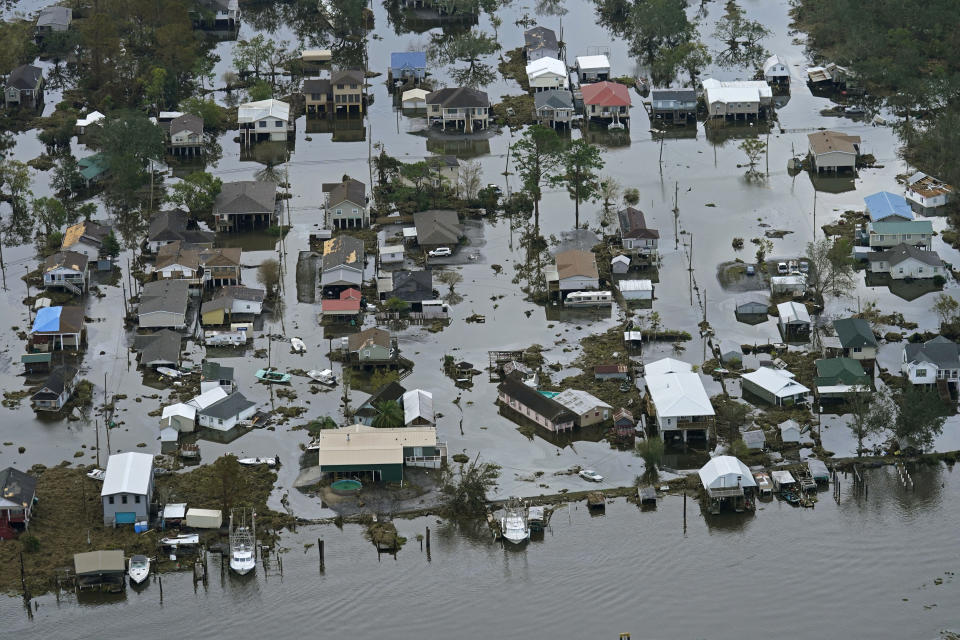 FILE - In this Wednesday, Sept. 1, 2021 file photo, floodwaters slowly recede in the aftermath of Hurricane Ida in Lafitte, La. On Thursday, Oct. 14, 2021, the National Oceanic and Atmospheric Administration announced that a La Nina has formed, which can be bad news for parts of the parched West. It also could mean a more active Atlantic hurricane season. (AP Photo/Gerald Herbert, File)