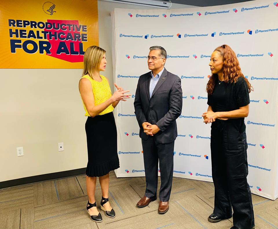 Dr. Jill Gibson, chief medical officer for Planned Parenthood Arizona (left) speaks with U.S. Health and Human Services Secretary Xavier Becerra and Arizona abortion rights advocate Joanna Sweatt in Phoenix on June 20, 2024.