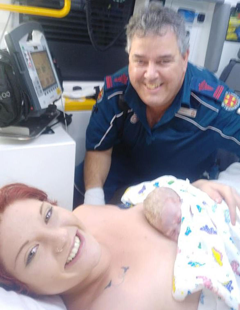 Happy and healthy mum and baby Andrew and the paramedic he was named after.