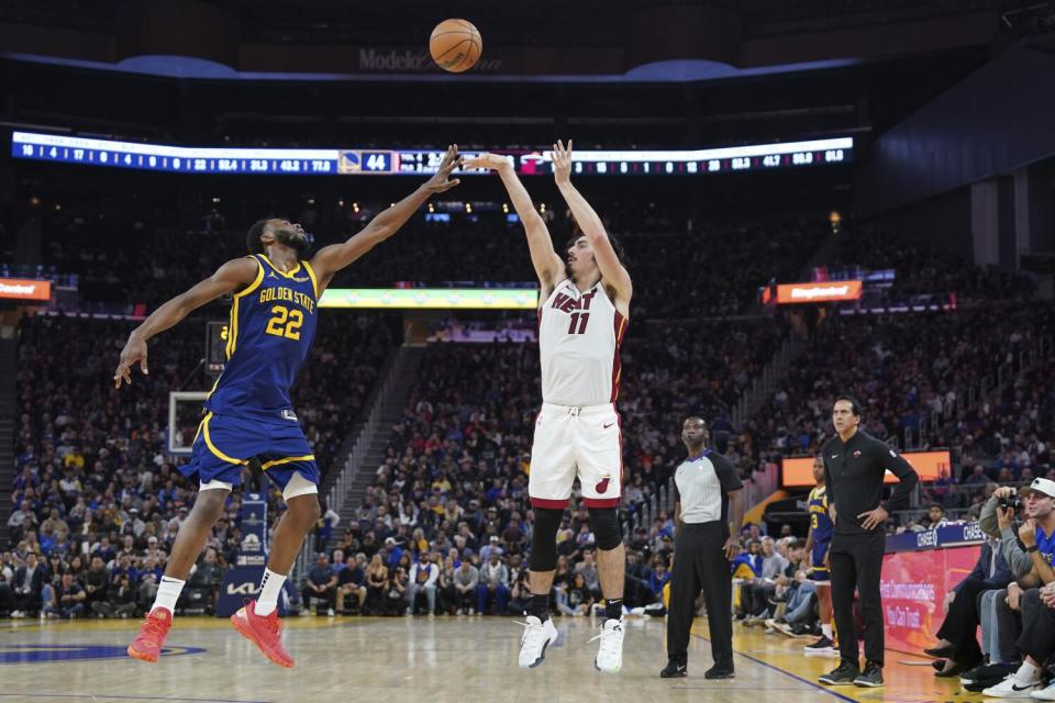 Heat guard Jaime Jaquez Jr. shoots over Warriors forward Andrew Wiggins on Dec. 28.