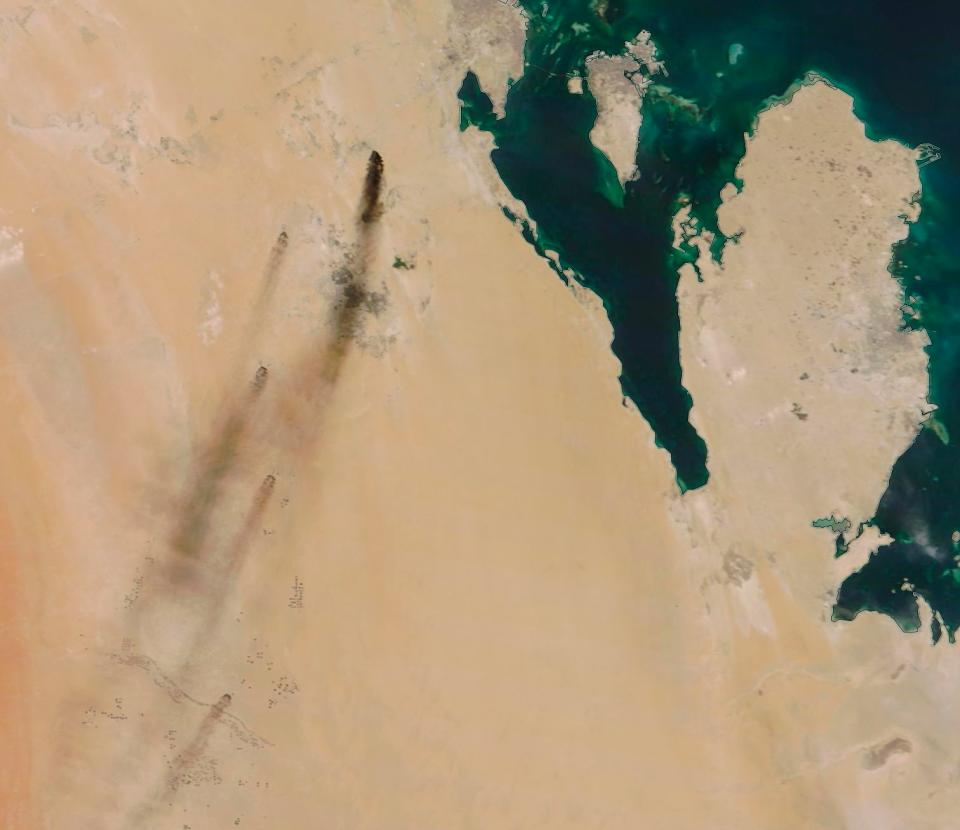 This Saturday, Sept. 14, 2019, satellite image provided by NASA Worldview shows fires following Yemen's Houthi rebels claiming a drone attack on two major oil installations in eastern Saudi Arabia. The drones attacked the world's largest oil processing facility in Saudi Arabia and a major oilfield operated by Saudi Aramco early Saturday, sparking a huge fire at a processor crucial to global energy supplies. The island shown in the image is Bahrain, while the peninsula in the image is Qatar.