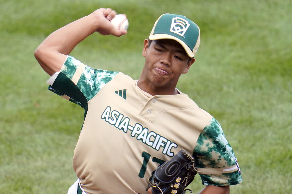 Taiwan starting pitcher Fan Chen-Jun (17) delivers a pitch against Canada during the first inning of a baseball game at the Little League World Series tournament in South Williamsport, Pa., Thursday, Aug. 17, 2023. (AP Photo/Tom E. Puskar)