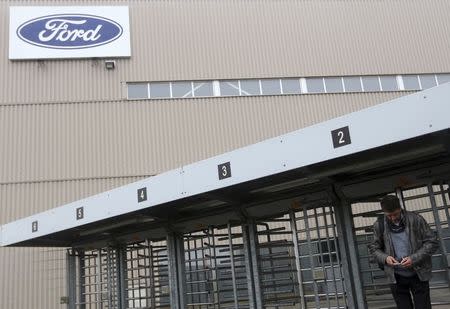 A worker leaves the factory for one of the final shifts at the Ford assembly plant in Genk December 17, 2014. REUTERS/Francois Lenoir