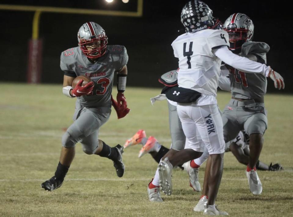 South Pointe’s Ja’Quan Thompson carries the ball against York in a regular season game that decided the 2021 Region 4-3A championship. South Pointe won.