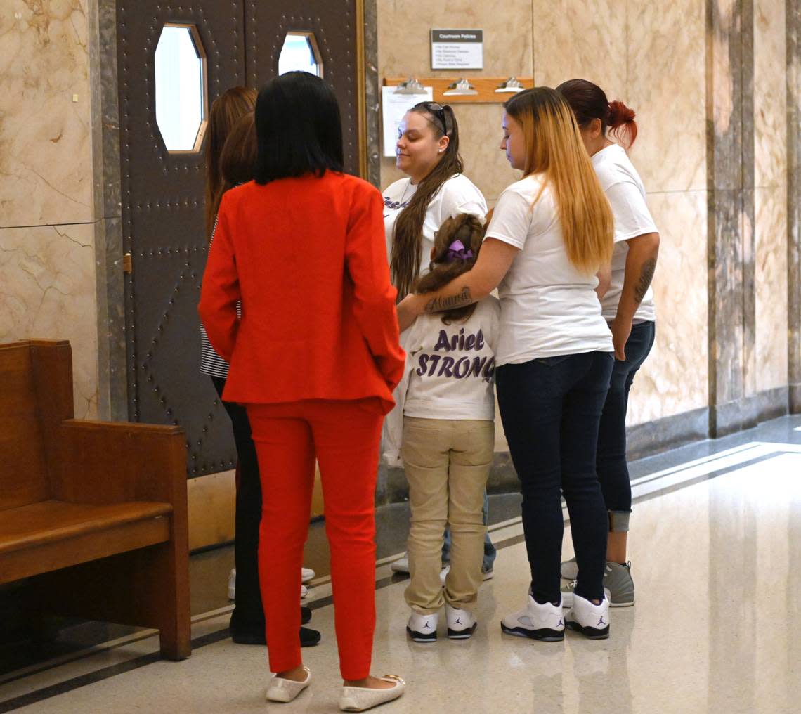 Felicia Moore, right, put her arm around her daughter, Ariel Young while they waited outside a Jackson County courtroom Tuesday, Nov. 1, 2022, to learn the sentence handed down to Britt Reid for a DUI conviction. The former assistant coach and son of head coach Andy Reid pleaded guilty to driving while intoxicated and causing a 2021 crash that severely injured Young.