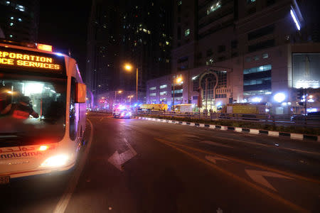 Dubai Emergency Response teams and Dubai police are seen on the street near Dubai's Torch tower residential building in the Marina district, Dubai, United Arab Emirates, early hours of August 4, 2017. REUTERS/Hamad I Mohammed