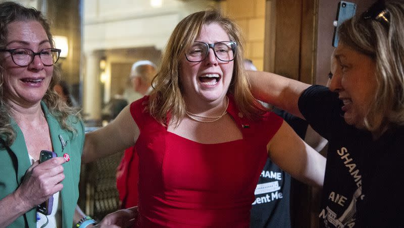 State Sen. Machaela Cavanaugh, center, hugs supporters after a bill seeking to ban abortion in Nebraska after about six weeks fails to advance, Thursday, April 27, 2023, at the Nebraska State Capital in Lincoln, Neb.