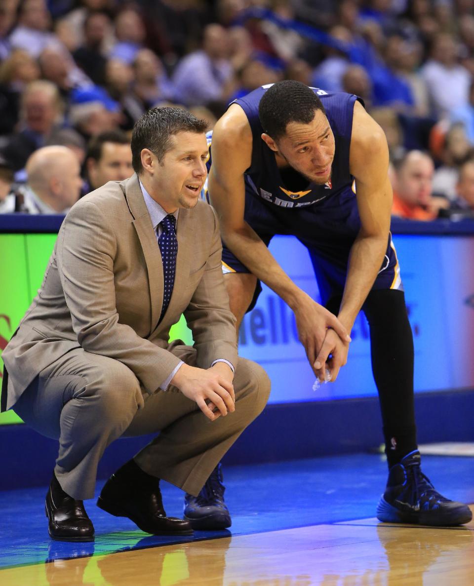 Memphis Grizzlies head coach David Joerger talks to Tayshaun Prince (21) during the second quarter of an NBA basketball game against the Oklahoma City Thunder on Monday, Feb. 3, 2014, in Oklahoma City. (AP Photo/Alonzo Adams)