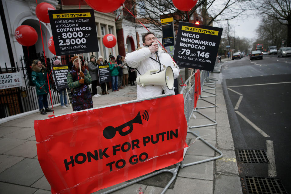 Chichvarkin speaks into a megaphone as he joins demonstrators opposing the Russian presidential election process outside the Russian Embassy in Kensington, London on March 18, 2018.<span class="copyright">Tim Ireland—AP</span>