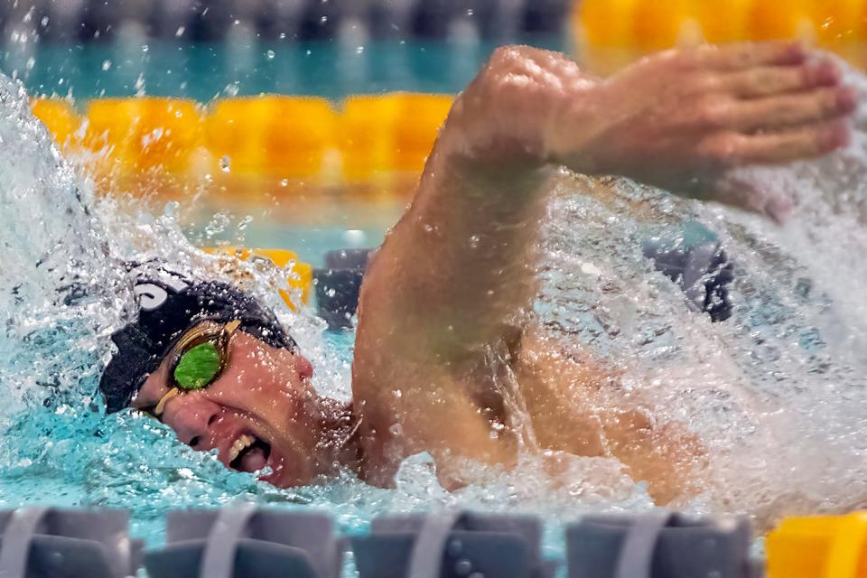 Galesburg High School junior Luke Foster swims the anchor leg of the 400 yard freestyle relay during a WB6 Conference meet with Rock Island on Tuesday, Jan. 25, 2022 at Mustain Pool. The Silver Streaks won the event in 3:39.32.