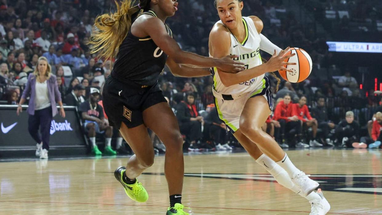 <div>LAS VEGAS, NEVADA - SEPTEMBER 26: Satou Sabally #0 of the Dallas Wings drives against Jackie Young #0 of the Las Vegas Aces in the first quarter of Game Two of the 2023 WNBA Playoffs semifinals at Michelob ULTRA Arena on September 26, 2023 in Las Vegas, Nevada. The Aces defeated the Wings 91-84. NOTE TO USER: User expressly acknowledges and agrees that, by downloading and or using this photograph, User is consenting to the terms and conditions of the Getty Images License Agreement. (Photo by Ethan Miller/Getty Images)</div>