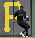 Pittsburgh Pirates center fielder Starling Marte pulls in a single hit by Cincinnati Reds' Alex Wood in the third inning of a baseball game Saturday, Aug. 24, 2019, in Pittsburgh. (Matt Freed/Post-Gazette via AP)