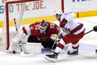 Florida Panthers goaltender Sergei Bobrovsky (72) stops a shot goal by Carolina Hurricanes center Vincent Trocheck (16) during the second period of an NHL hockey game Thursday, April 22, 2021, in Sunrise, Fla. (AP Photo/Marta Lavandier)