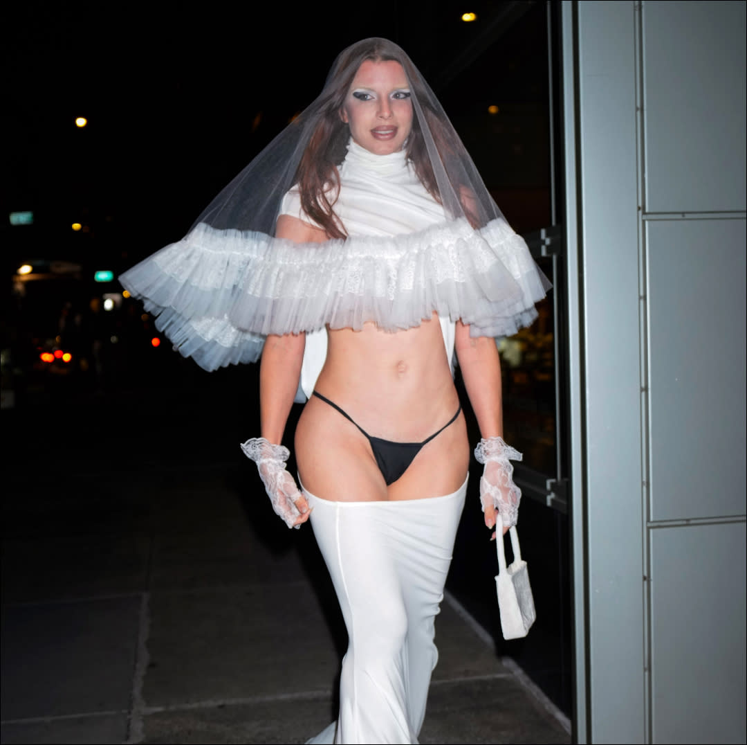  Julia fox in a black thong and white veil and wedding dress. 